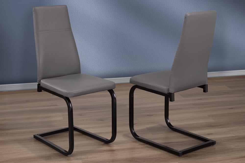 Set of 2 grey leatherette dining chairs with black wrap-around legs