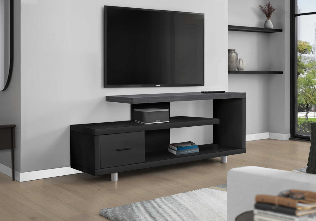 Black and grey TV stand with drawer and shelves