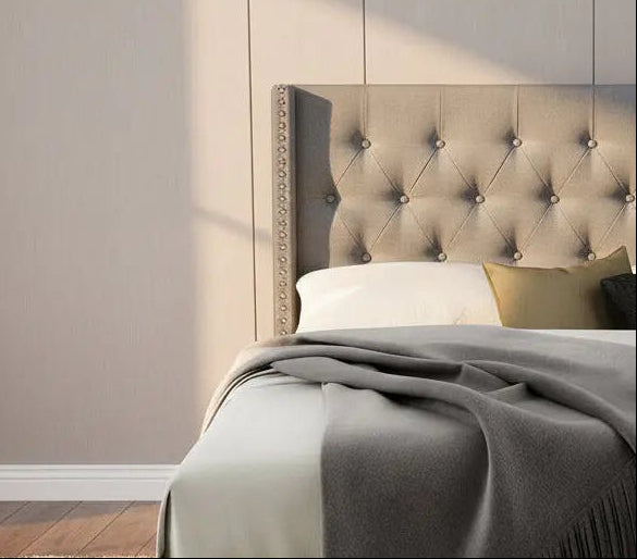 Grey wingback queen bed frame with tufted upholstery and nailhead trim, featuring a classic design by Meuble Divino.