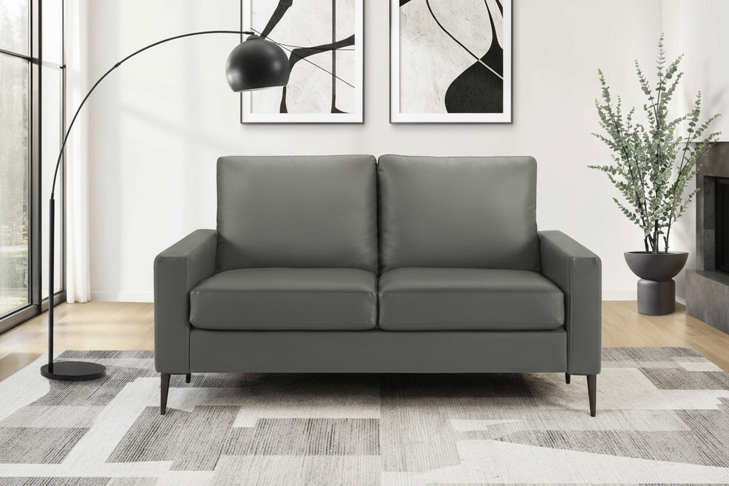 Meuble Divino Monroe sofa with plush gray fabric, modern design, and cushioned armrests in a contemporary living room setting.