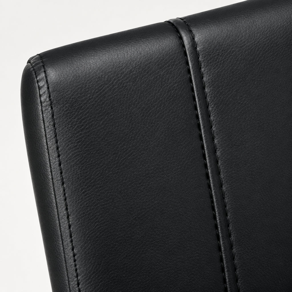 Set of 2 modern leather-look dining chairs with black metal legs from Meuble Divino, featuring sleek design and comfortable seating.