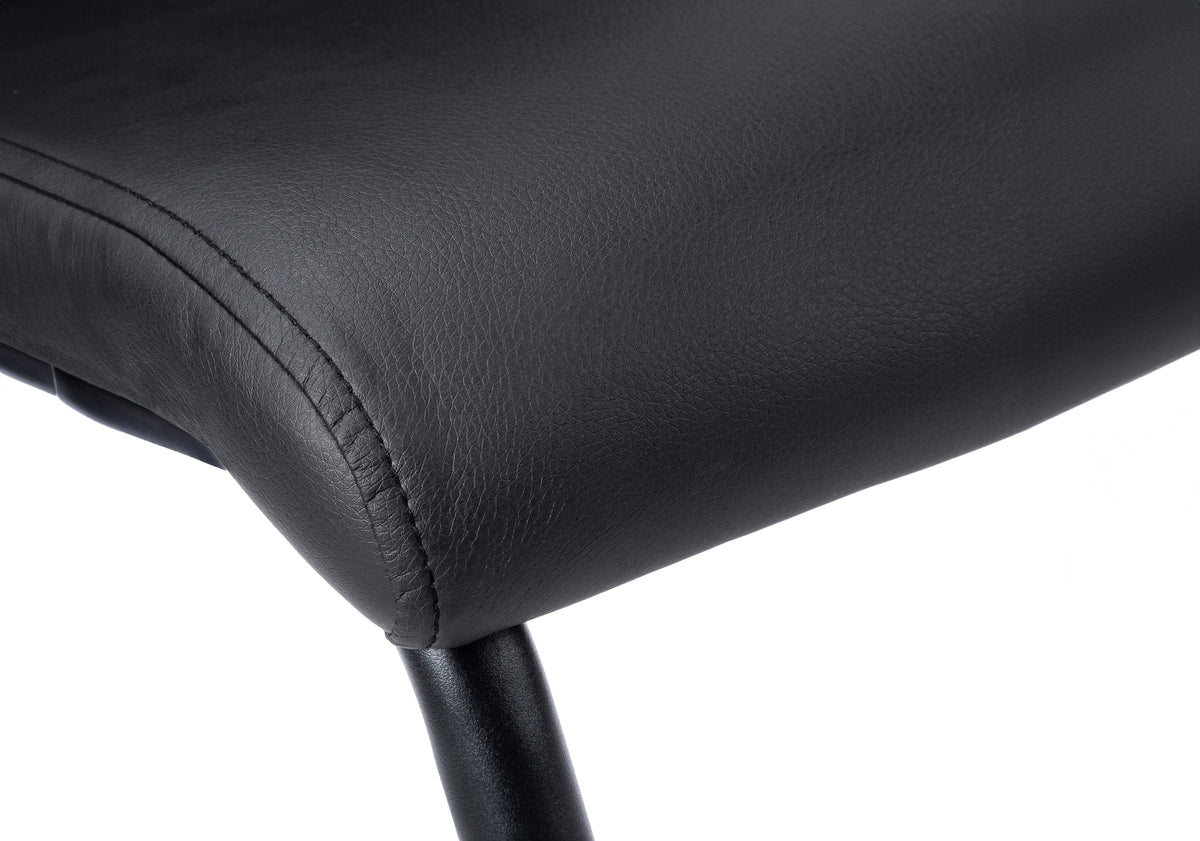 Set of 2 modern leather-look dining chairs with black metal legs, stylish and comfortable for contemporary dining rooms.