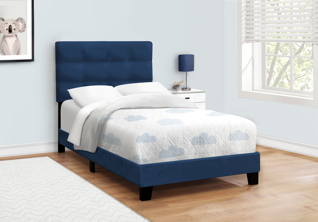 Navy blue velvet single bed with a modern design, featuring a padded headboard and sleek frame from Meuble Divino.
