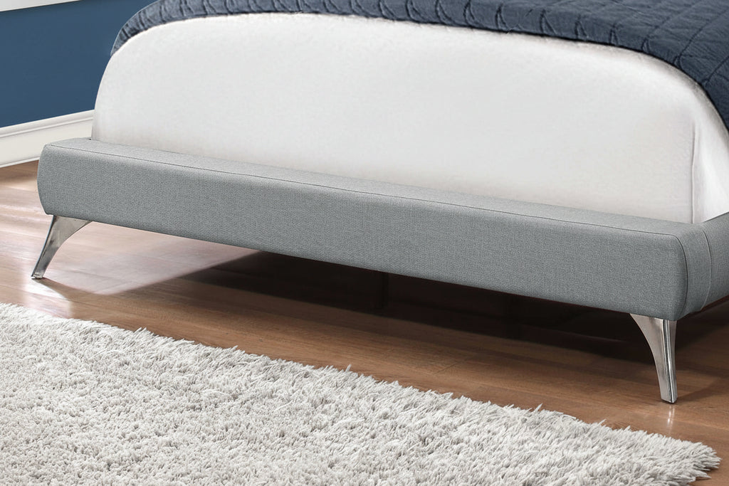 Meuble Divino Elara Bed with upholstered headboard and wooden frame in a modern bedroom setting.