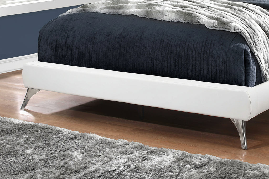 Meuble Divino Elara Bed with wooden frame and upholstered headboard, shown in a modern bedroom setting.