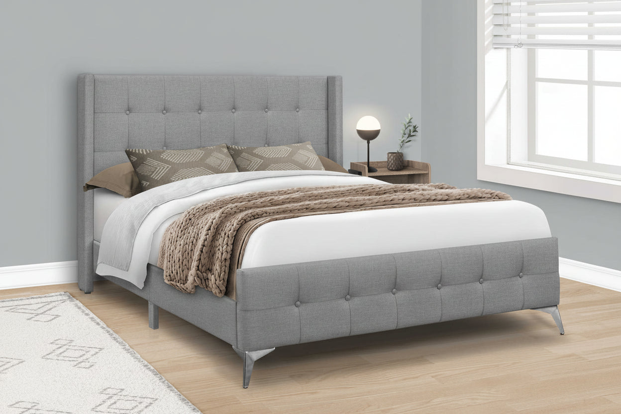 Queen upholstered bed by Meuble Divino with tufted headboard and chrome legs, showcasing the elegant design and plush fabric.