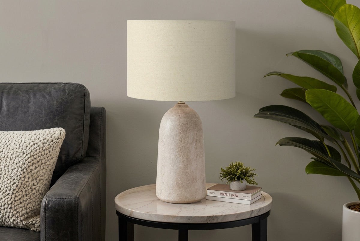 Elara textured ceramic table lamp with a modern design, featuring a neutral finish, from Meuble Divino accessories collection.